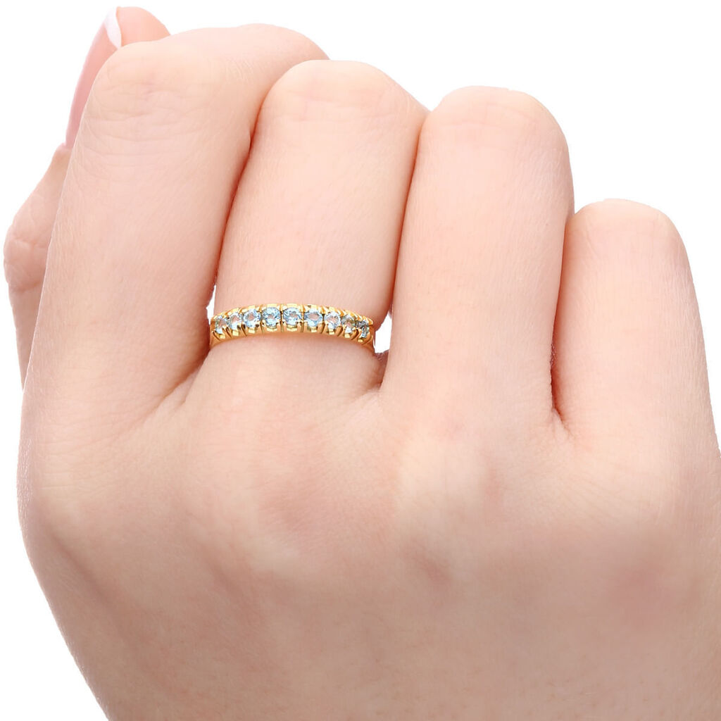 Meia Aliança em Ouro Amarelo 18k com Topazios Sky Blue