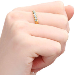 Meia Aliança em Ouro Amarelo 18k com Topazios Sky Blue